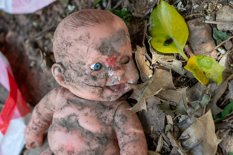 abandoned baby doll police tape crime scene